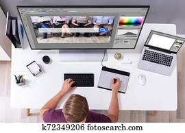 Designer Editing Photo On Computer Designer Editing Photo On Computer