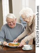Senior Couple Enjoying Meal Together Senior Couple Enjoying Meal Together