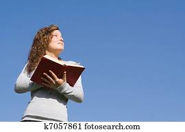 christian kid at bible camp reading gospel