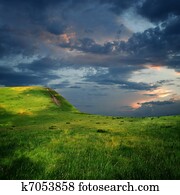 edge of mountain plateau and majestic sky with clouds