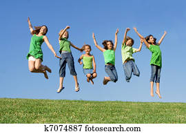 happy group of mixed race kids at summer camp or school jumping happy group of mixed race kids at summer camp or school jumping
