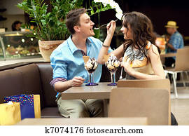 young couple enjoying ice cream