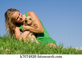 young woman or teen girl playing with pet cocker dog young woman or teen girl playing with pet cocker dog