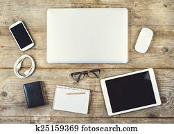 Desktop mix on a wooden office table.