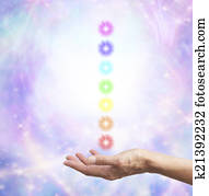 Holding chakra energy in open hand 