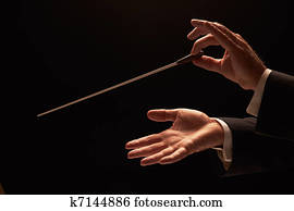 Conductor conducting an orchestra Conductor conducting an orchestra