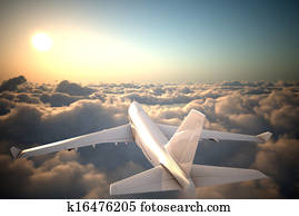 Airplane flying above clouds Airplane flying above clouds