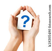 hands holding house with question mark hands holding house with question mark