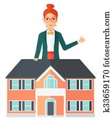 Real estate agent showing thumb up.