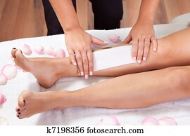 Beautician doing depilation