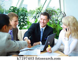 Business people shaking hands, finishing up a meeting Business people shaking hands, finishing up a meeting