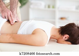 Chiropractor massaging a woman Chiropractor massaging a woman