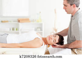 Chiropractor stretching a charming woman Chiropractor stretching a charming woman