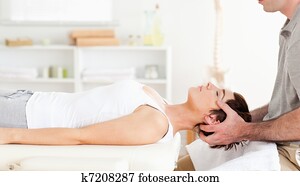 Chiropractor stretching a cute woman Chiropractor stretching a cute woman