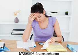 Frustrated young woman accounting Frustrated young woman accounting