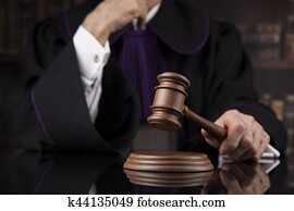 Justice and law concept. Male judge in a courtroom Justice and law concept. Male judge in a courtroom