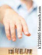 Businessman hand reaching for pennies