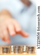 Businessman hand reaching for pennies
