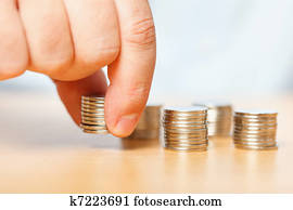 Businessman hand reaching for pennies