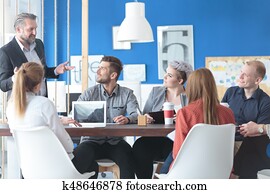 Employees listening to their manager Employees listening to their manager