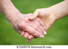 Senior and Young Women Holding Hand Senior and Young Women Holding Hand