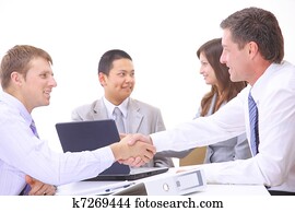 Business people shaking hands, finishing up a meeting Business people shaking hands, finishing up a meeting