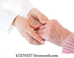 Doctor holding senior lady's hands