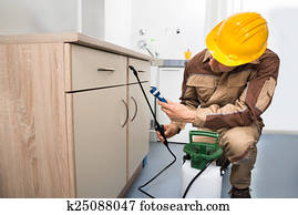 Pest Control Worker Spraying Pesticides Pest Control Worker Spraying Pesticides