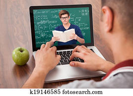 Student Attending Online Math's Lecture On Laptop Student Attending Online Math's Lecture On Laptop
