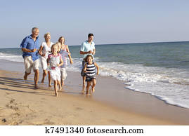 Portrait Of Three Generation Family On Beach Holiday Portrait Of Three Generation Family On Beach Holiday