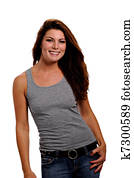 Smiling woman wearing jeans & a gray tank top