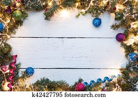 Festive background with wooden surface and Christmas decorations
