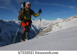 Ski touring in winter mountains. Outdoor pursuit