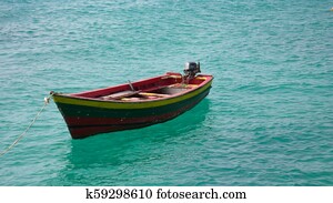 fishing boat on a shimmering ocean
