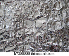 Crushed ball of aluminum foil Stock Photography x15570331