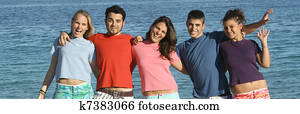 friendship group of teens, youth, kids or students at the beach,