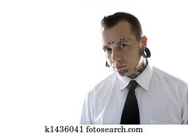 Man with tattoos and piercings.