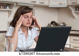 Business person with headache in work