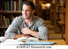 Smiling male student working Smiling male student working