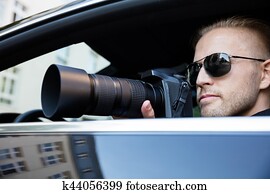 Man Photographing With SLR Camera