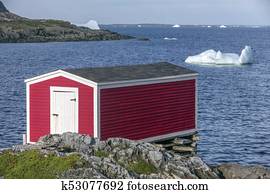 red fishing stage and icebergs