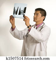 Doctor examining x-ray.