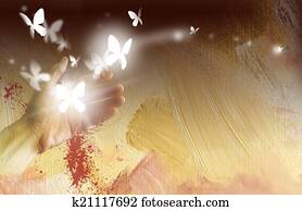 Hand with glowing butterflies Hand with glowing butterflies