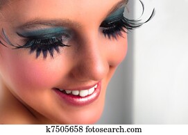 Closeup of a pretty girl with extreme makeup