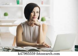 Young woman using laptop