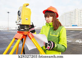 surveyor works with theodolite