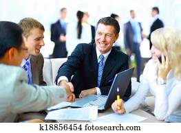 Business people shaking hands, finishing up a meeting Business people shaking hands, finishing up a meeting