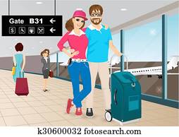 happy couple standing in an airport happy couple standing in an airport