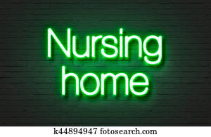 Nursing home neon sign on brick wall background.