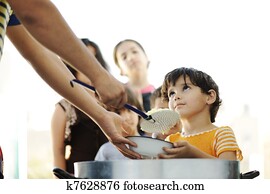 Hungry children in refugee camp, distribution of humanitarian food